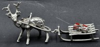 Auktion 367 / Los 11023 <br>Silber Rentier mit Schlitten, H-4 cm, L-10 cm, 27 gr.