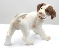 Auktion 367<br>Pointerwelpe, Bing &amp; Gr&ouml;ndahl, Entw. Lauritz Jensen, Modellnr. 2026, braun staffiert in Unterglasurfarben, H-11,5cm L-17cm