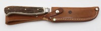 Auktion 368<br>Jagdmesser, Puma, Geweihgriffschalen, Lederscheide, ca. L-22,5cm
