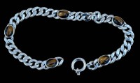 Auktion 368<br>Armband mit Tigerauge, Silber, L.19cm, 17,6 g.