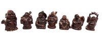 Auktion 369<br>kleine Figurengruppe von 7 Buddhas aus Holz, teilweise leicht  besto&szlig;en, ca. H-5,5cm