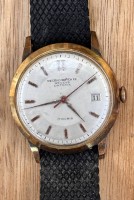 Auktion 369 / Los 2013 <br>Record Geneve Datofix Vintage-Herrenarmbanduhr. Werk l&auml;uft, Tragespuren