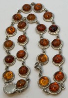 Auktion 370 / Los 1030 <br>lange Silberhalskette-925- mit Bernsteinen, alle einzeln Silber gefasst, L-ca. 45 cm, 42,2 gr, 2x Initialen, 1x GK, 1x JN ?