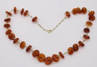 Auktion 370<br>Halskette mit facett. Bernsteinen, ca. L-60cm, 39,7gr.