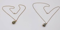 Auktion 370<br>2x Modeschmuckketten mit emaillierten Anh&auml;nger in Faberg&eacute;-Art, ca. L-52cm Anh. 2,5cm, 1x zum &ouml;ffnen