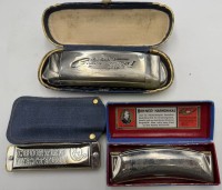 Auktion 370<br>3x alte kleine Mundharmonikas, 2x Hohner, 1x DDR, alle in Etuis