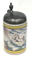 Auktion 371 / Los 9009 <br>Fayence Walzenkrug um 1770, springendes Pferd mit Zinndeck, Meistermarke datiert 1747 , Boden mit Altrissen, H-22 cm, D-11 cm