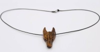 Auktion 371<br>Wolfskopfanh&auml;nger aus Tigerauge, an Lederband, Anh. L-4cm