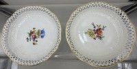 Auktion 371 / Los 8152 <br>Zwei "KPM" Berlin Schalen mit Blumenmalerei, Durchbruchrand und Reliefdekor, H-4 cm, D-20 cm, guter Zustand