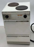 Auktion 371<br>elektrischer Puppenherd, H-22 cm, ca. 14x14 cm