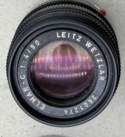 Auktion 372<br>Leitz Wetzlar Elmar-C 90mm f/4 Objektiv. Seriennummer 2601274.Guter Zustand in Lederbeutel