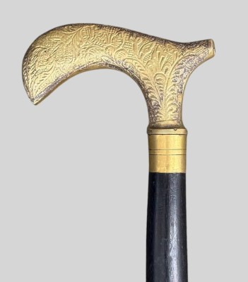 Auktion 373<br>ebonisierter Gehstock mit Messinggriff und Messing-Einlagen,  L-93 cm [1]