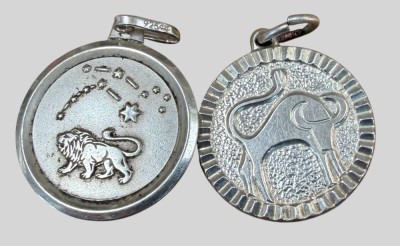 Auktion 374<br>2x Silber-925- Sternzeichen Anhänger, Löwe und Stier, D-ca. 2 cm, zus. 5,86 gr [1]