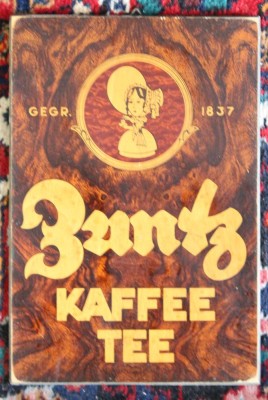 Auktion 376<br>dekorative Holztafel mit historischer Werbung der Kaffeemarke A. Zuntz, älter, ca. 34 x 23cm [1]