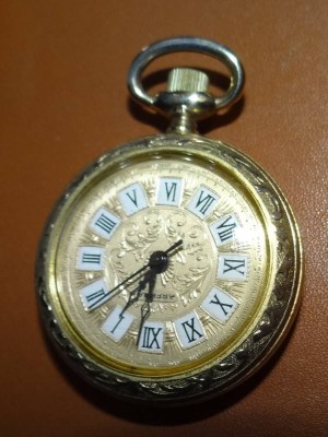 Auktion <br>mechan. Damen-Umhängeuhr 