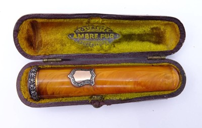 Auktion 340<br>Alte Bernstein Zigarrenspitze, Silber+Gold Montur [1]