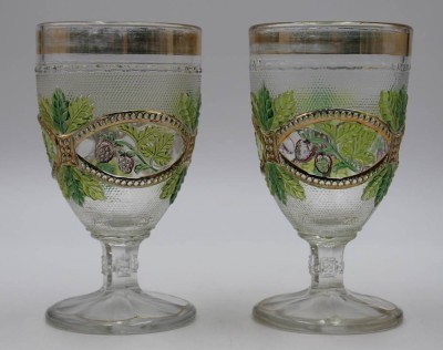 Auktion <br>Paar  Weingläser um 1900, Pressglas mit Reliefdekor, teilw. farbig u. berieben, ca. H-13,5cm. [1]
