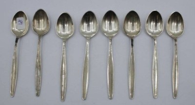 Auktion 359<br>8x Mokkalöffel, Georg Jensen, Cypress, 925er Silber, zus. 118,7gr., L-11cm. [1]