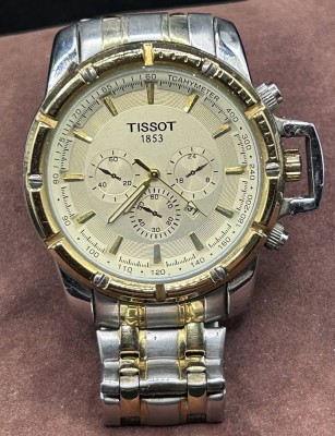Auktion 348<br>Tissot Chronograph mit orig. Band, Quartzwerk läuft (Tachymeter falsch geschrieben?) Stahl/Gold XL Grösse, B-5,5 cm [1]