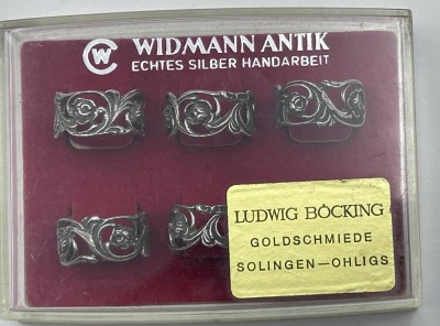 Auktion 353<br>6 kl. Serviettenringe Silber-835- in Kasten, Rosenmuster [1]