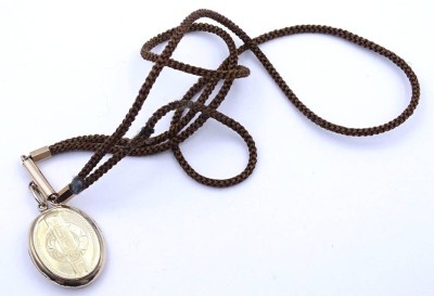 Auktion 356<br>Echthaar Uhrenkette mit Fotomedaillon (goldfarben), L. 37cm, Medaillon 27x21mm [1]