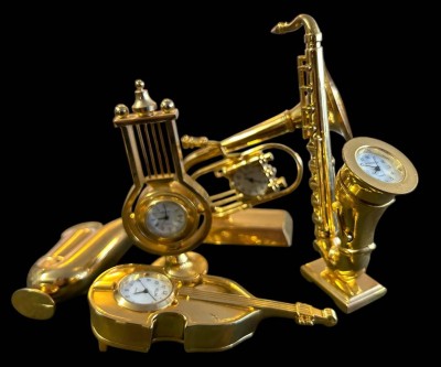 Auktion 356<br>6x div. Quartz Tischuhren in Musikinstrumenten, goldfarben [1]