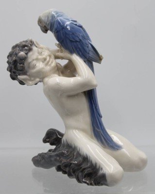 Auktion 358<br>Faun und Papagei, Royal Copenhagen, polychrom bemalt, Modellnr. 752, monogrammiert: Chr. Th. (Christian Thomsen), Schwanzfeder bestossen, H-18cm [1]