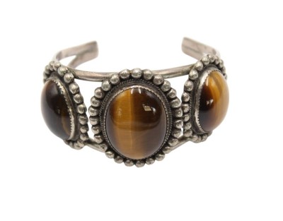 Auktion 358<br>breite Armspange, Sterling mit gr. Tigeraugen, Mexico, ca. D-6cm B-4cm, 66,8gr. [1]