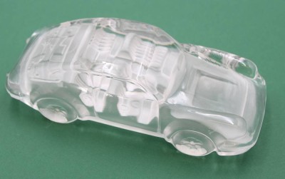 Auktion 359<br>Porsche aus farblosem Glas, Briefbeschwerer, ca. H-4,8cm L-16cm [1]