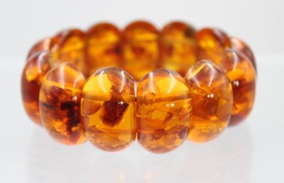 Auktion 359<br>Zugarmband, geklärter Bernstein, 39,8gr., B-2,5cm [1]