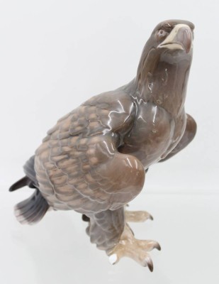 Auktion 360<br>Adler, Bing & Gröndahl, Copenhagen, Modellnr. 1925, farbig staffiert in Unterglasur, Entw. Knud Moller, Schwanzfeder und Karalle bestossen, ca. H-22,5cm [1]