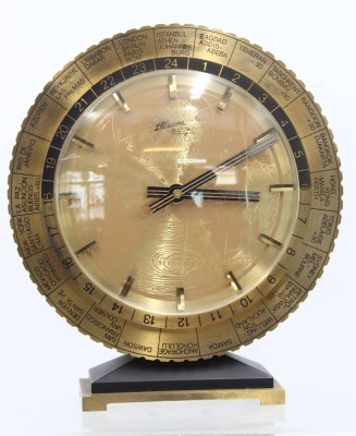 Auktion 360<br>Weltzeit-Tischuhr in Messinggehäuse,  Atlanta electric, Western Germany, Batteriewerk, H-22,5cm,  Werk läuft [1]