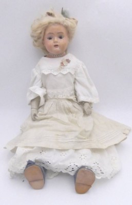 Auktion 363<br>Mädchenpuppe, Massekopf (Wange mit Riss) und Lederkörper, H-54 cm, wohl unter geklebter Perücke gemarkt [1]