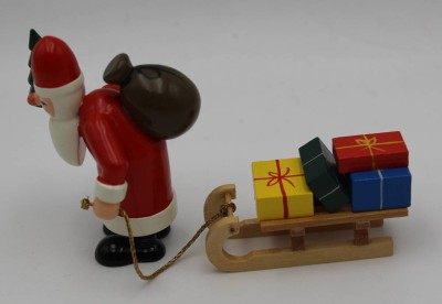 Auktion 364<br>Erzgebirge Nikolaus mit Schlitten voller Pakete,  H-7 cm, L-11 cm [1]