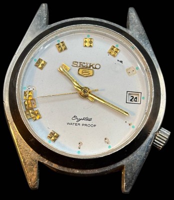 Auktion 365<br>SEIKO 5 Crystal mechan. HAU ohne Band, Werk läuft, einige Stunden-Anzeige Plättchen lose, D-ca. 4 cm [1]