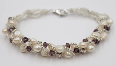 Auktion 367<br>Armband, SW-Perlen und wohl Amethyste, Silberschließe, ca. L-19,5cm [1]