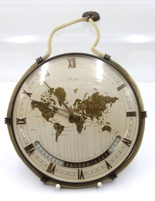 Auktion 367<br>Weltzeit-Wanduhr, Kienzle, Entw. von Heinrich Möller, Werk läuft, ca. D-25cm [1]