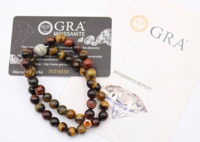 Auktion 368<br>2reihiges Tigeraugen-Armband mit einem 1ct Moissanite , ca. L-19cm, anbei GRA-Zertifikat [1]