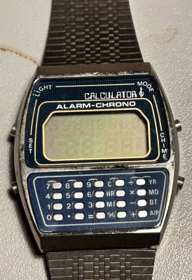 Auktion 368<br>Quartz  Armbanduhr mit Calculator, Metallband, nicht überprüft, ca 4 x 3,5cm [1]