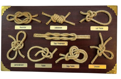 Auktion 369<br>kl. Knotenbrett, Holzplatte mit Messingecken,  21x36 cm, [1]