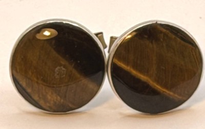 Auktion 370<br>Paar grosse Manchettenknöpfe, Silber-925-, Mexico, mit Tigerauge-Einlage, zus. 12 gr., D-ca. 2,2 cm [1]